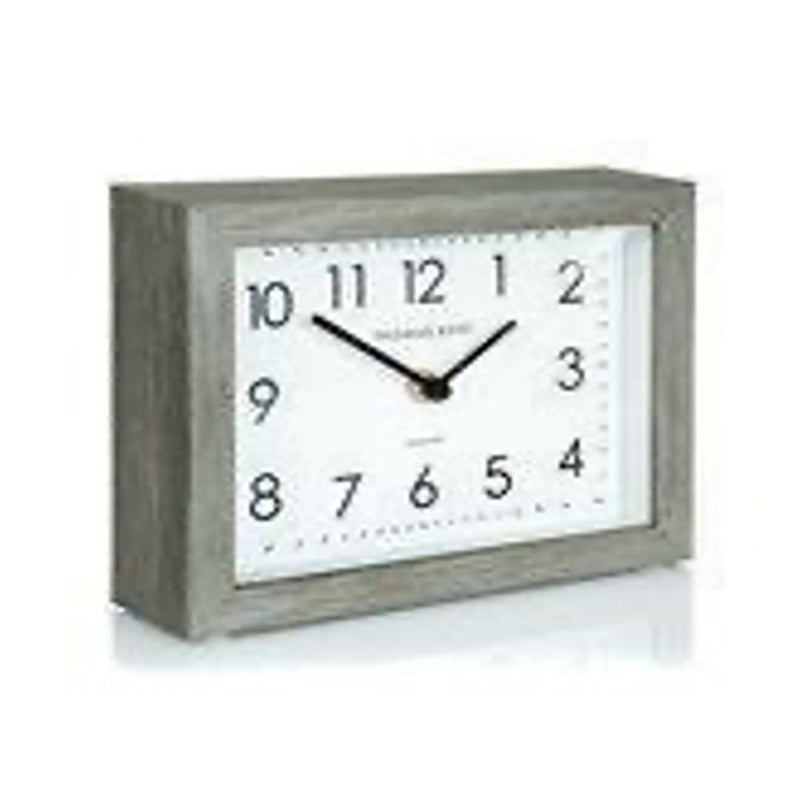 Tara Baker and brown mantel clock limestone